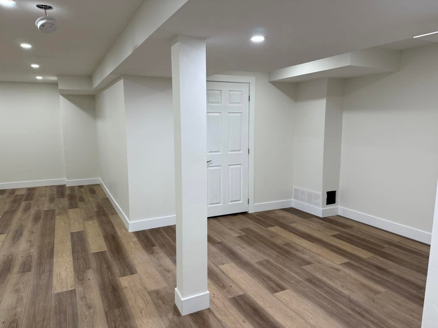 Finished basement with luxury vinyl flooring by AEG Home Improvements