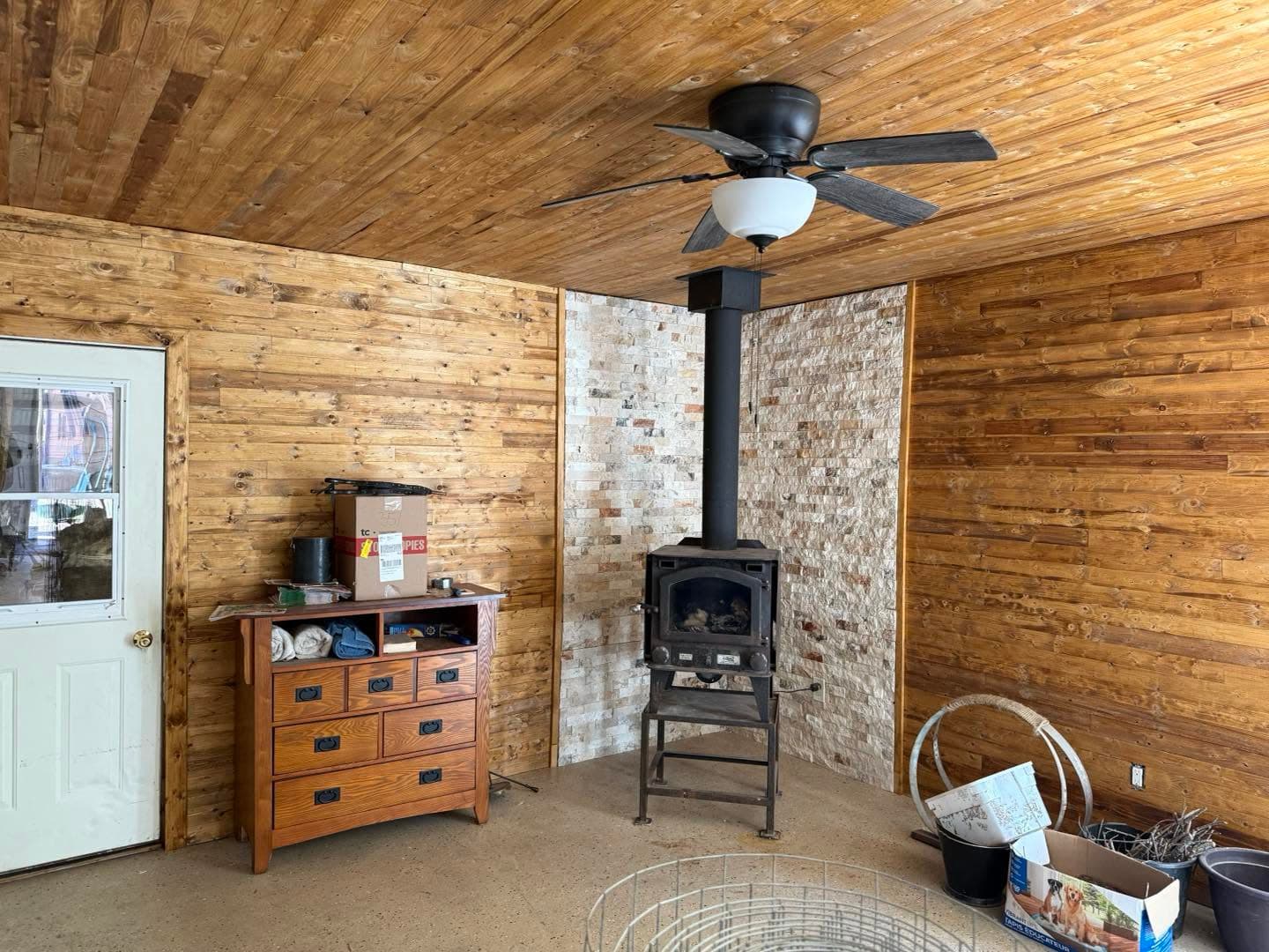 Garage converted into a finished cedar-lined room by AEG Home Improvements